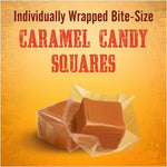 Melted Kraft caramel cubes being drizzled over chocolate baking brownies