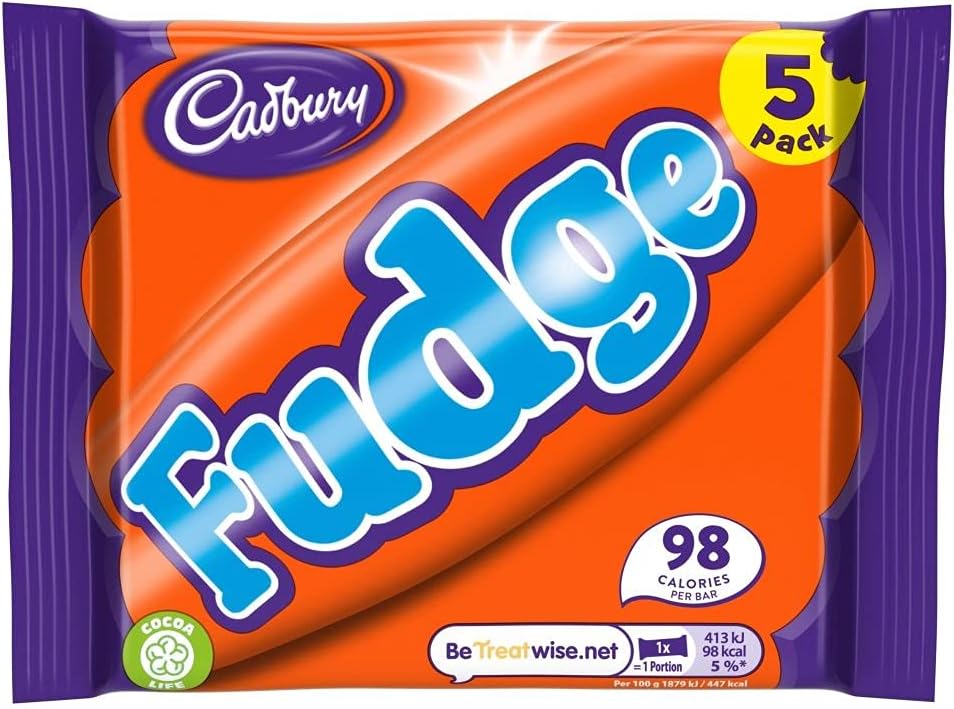 Soft chocolate fudge bar broken in half demonstrating the creamy texture