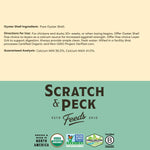 Scratch and Peck Feeds supplement pouch next to chicken coop