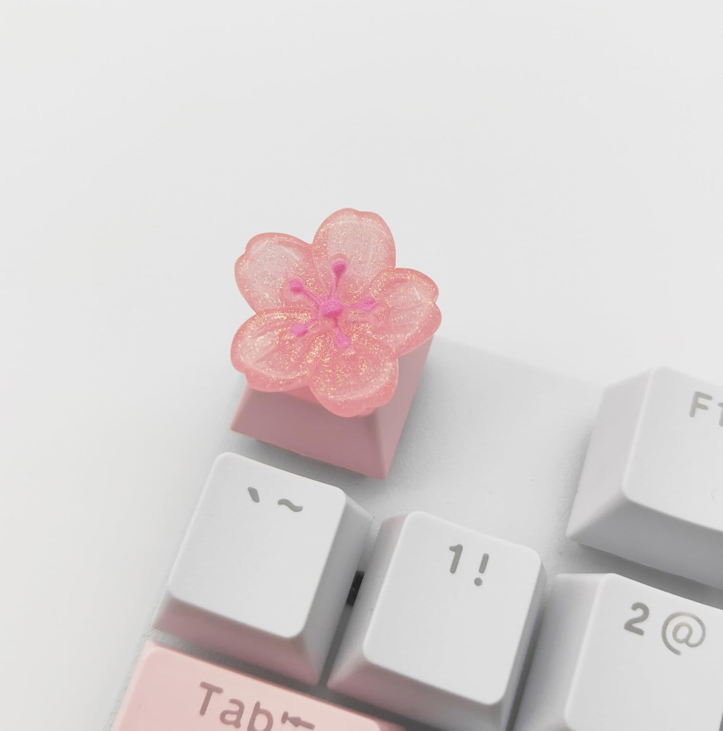 Elacgap personalized pink cherry blossom artisan keycap front view installed on a mechanical keyboard switch.