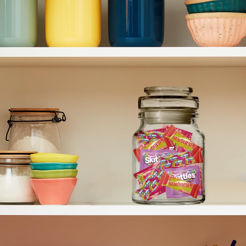 Wrigley's bulk candy assortment bag being opened for a party setting.