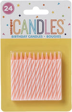 2.5 inch twisted wax cake candles lit on a birthday cake