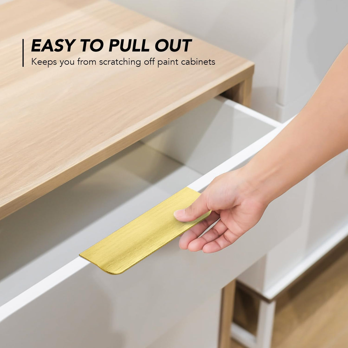 Low profile drawer pull mounted on kitchen cabinet