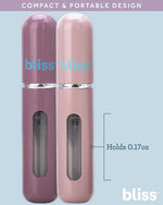 Four travel size mini perfume spray bottles arranged neatly to display different color variants.