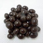 Close up view of premium dark chocolate coated whole coffee beans.