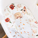 Watercolor floral pattern bassinet sheet close up