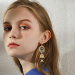 OIDIMS oxidized drop earrings side profile display.