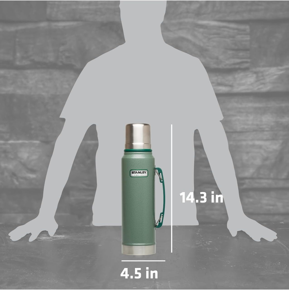 Stanley imported green thermal bottle being held by its sturdy handle