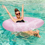 Decorative heart-shaped pink pool float at a summer party