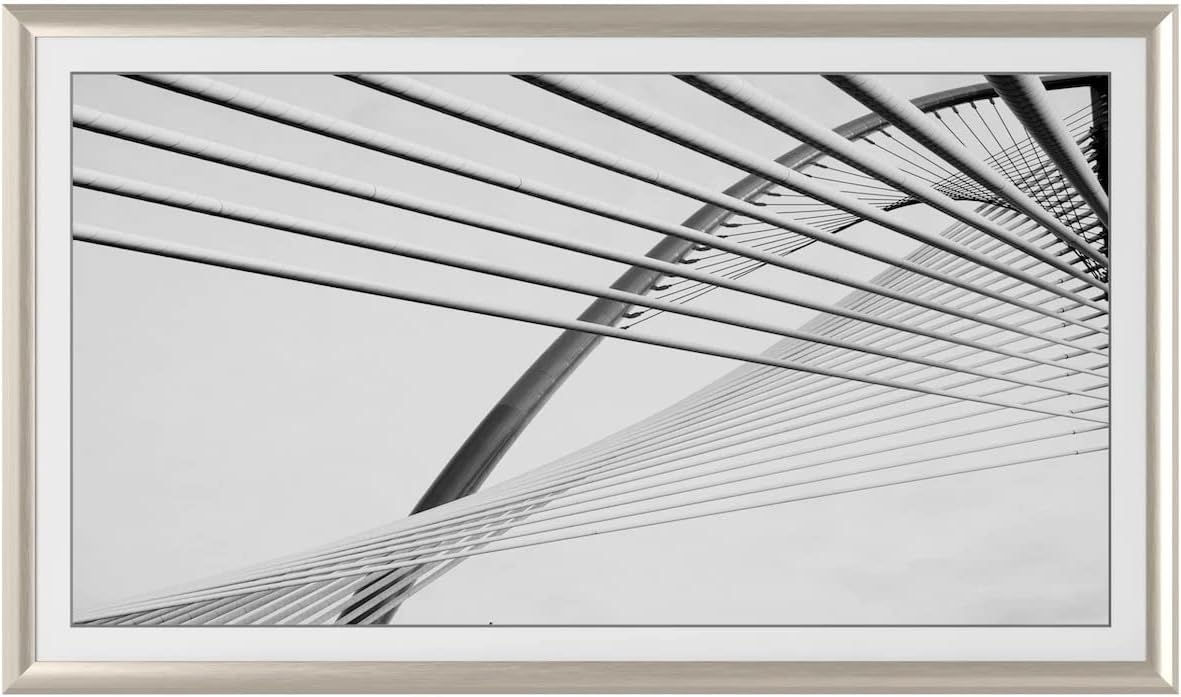 Deco TV frame mounted on a modern living room display wall