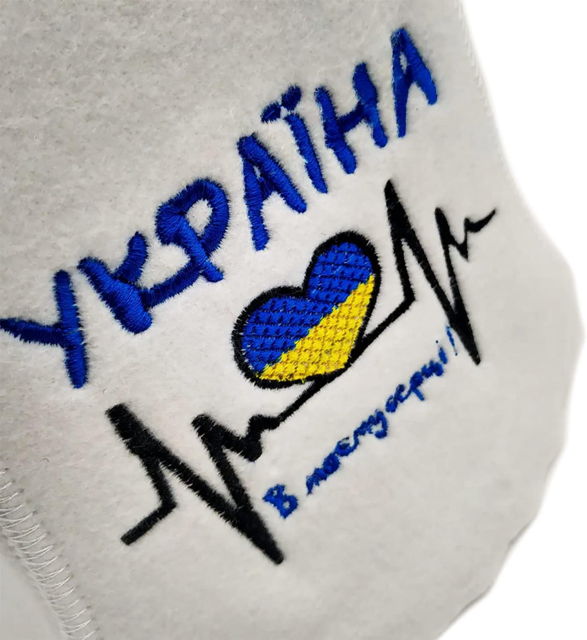 HatynkaUA Ukrainian felt sauna hat displayed showing embroidered heart design