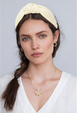 YISSION jeweled embellished hairband close-up of faux pearls and beadwork.