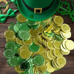 YOOBABOO 100 count holiday coins scattered around a festive leprechaun pot of gold centerpiece