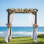 Wrinkle resistant white chiffon panels draped beautifully over a circular metal wedding arch
