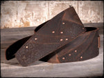 Anthology Gear Overland leather guitar strap resting on acoustic guitar body