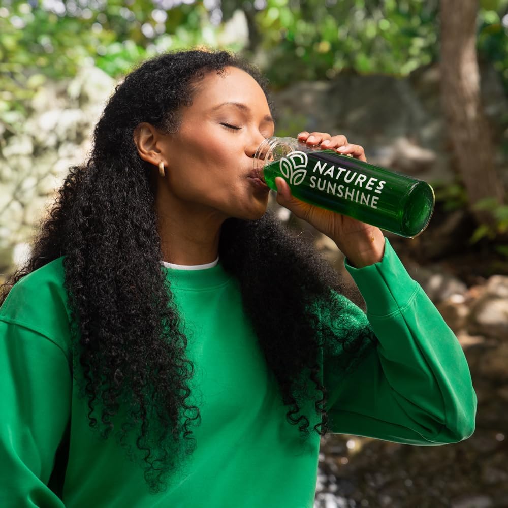 Nature's Sunshine Extra Strength Chlorophyll powder in glass of water