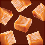 Kraft individually wrapped chewy caramel squares spread out on a table