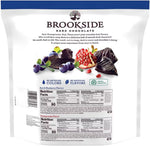 Close up of imported premium American dark chocolate candies with acai blueberry and pomegranate centers.