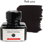 Jacques Herbin calligraphy set opened to display red velvet interior and ink bottle.