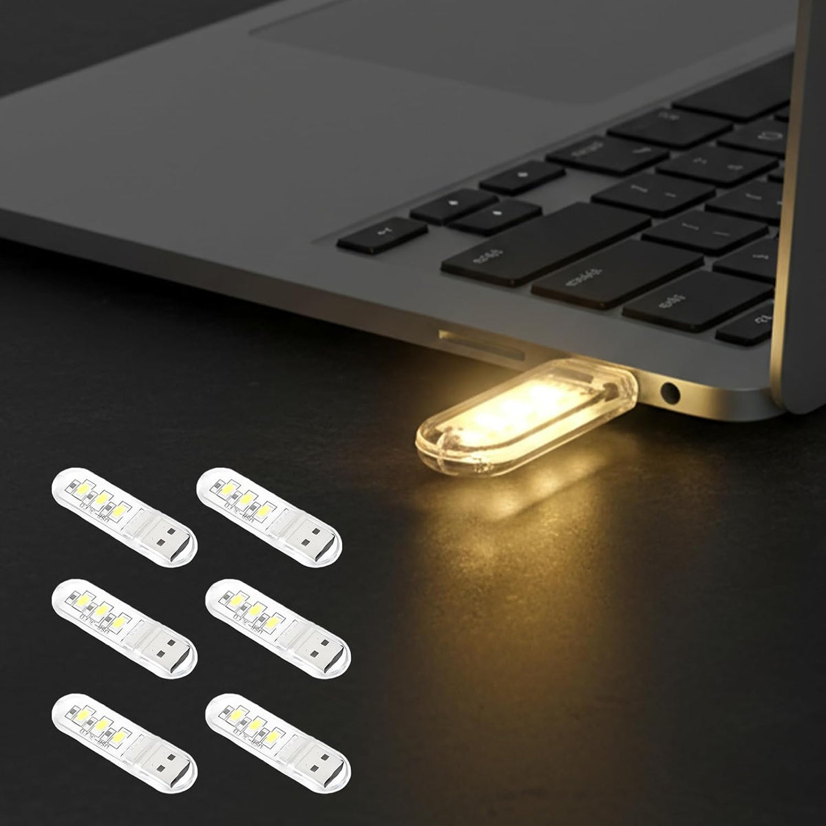 Justcellz 6 Piece USB Night Light front view showing compact mini LED bulbs plugged into a laptop port.
