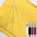 Assorted black white red and blue pen refills laid out neatly