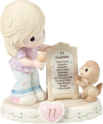 Precious Moments Age 11 birthday figurine displayed on a flat surface for scale