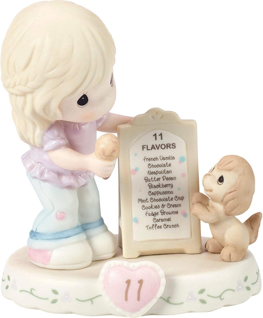 Precious Moments Age 11 birthday figurine displayed on a flat surface for scale