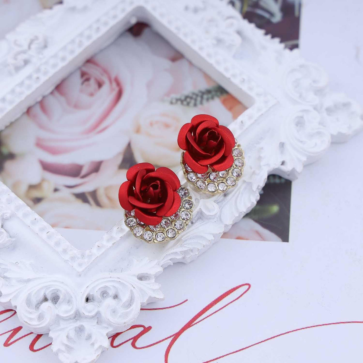 Zeshimb rose earrings worn on model for scale