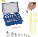 Close up view of stainless steel calibration weights and storage box