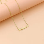 Lcherry name necklace shown with adjustable extension links