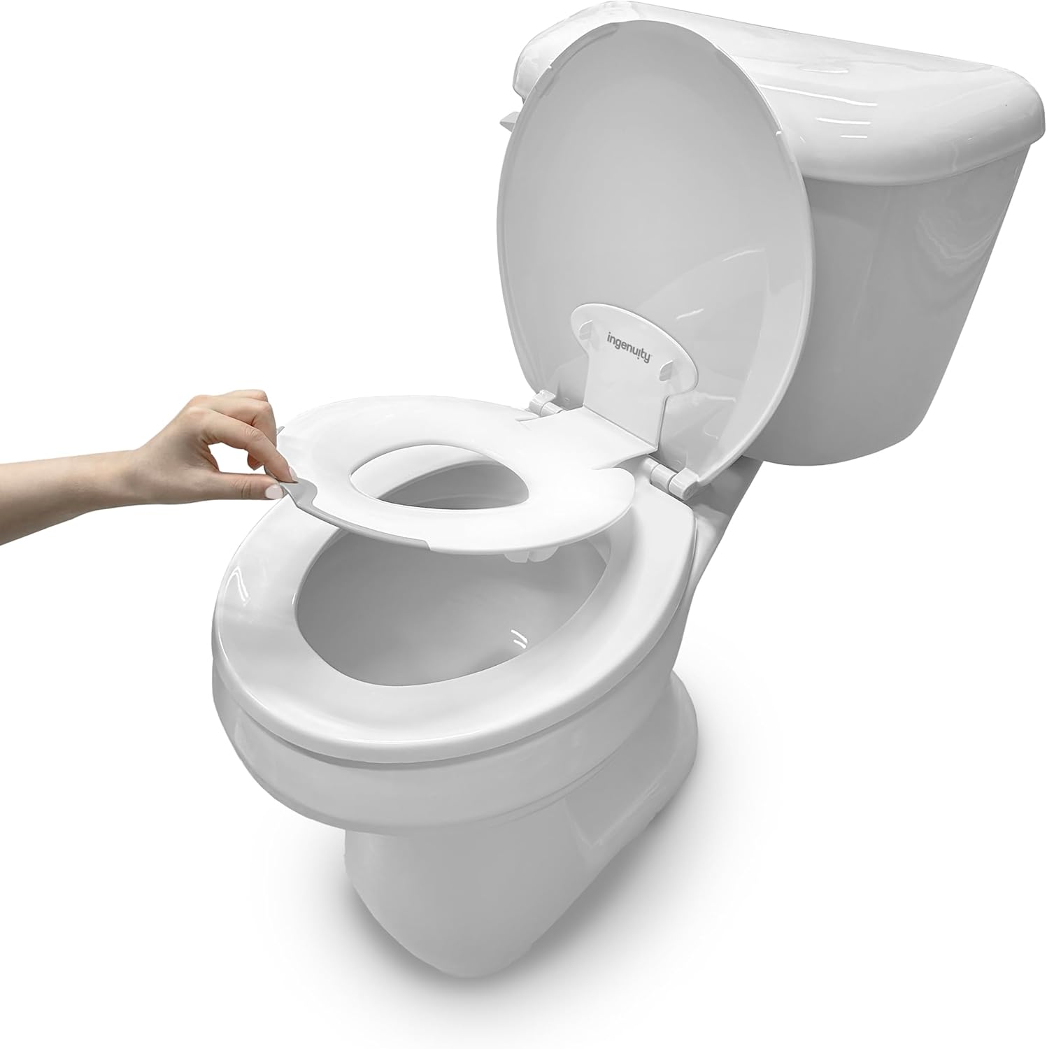 Ingenuity Ity by Ingenuity Flip and Sit Potty Seat in white shown attached to an adult toilet seat front view