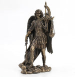 Side angle view of the Saint Michael figurine highlighting feathered wings.