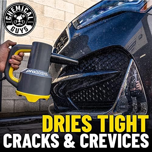 Lightweight 1000 watt Chemical Guys car wash blower being used to clear water from side mirrors and grilles.