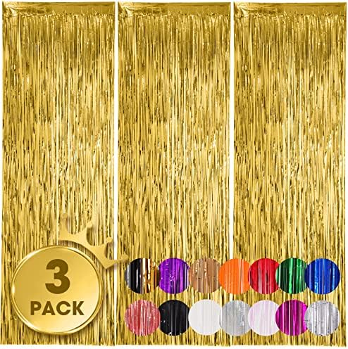Three pack metallic gold tinsel streamers installed on a smooth party wall.