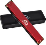 Musician holding the EastRock C key harmonica during a practice session.