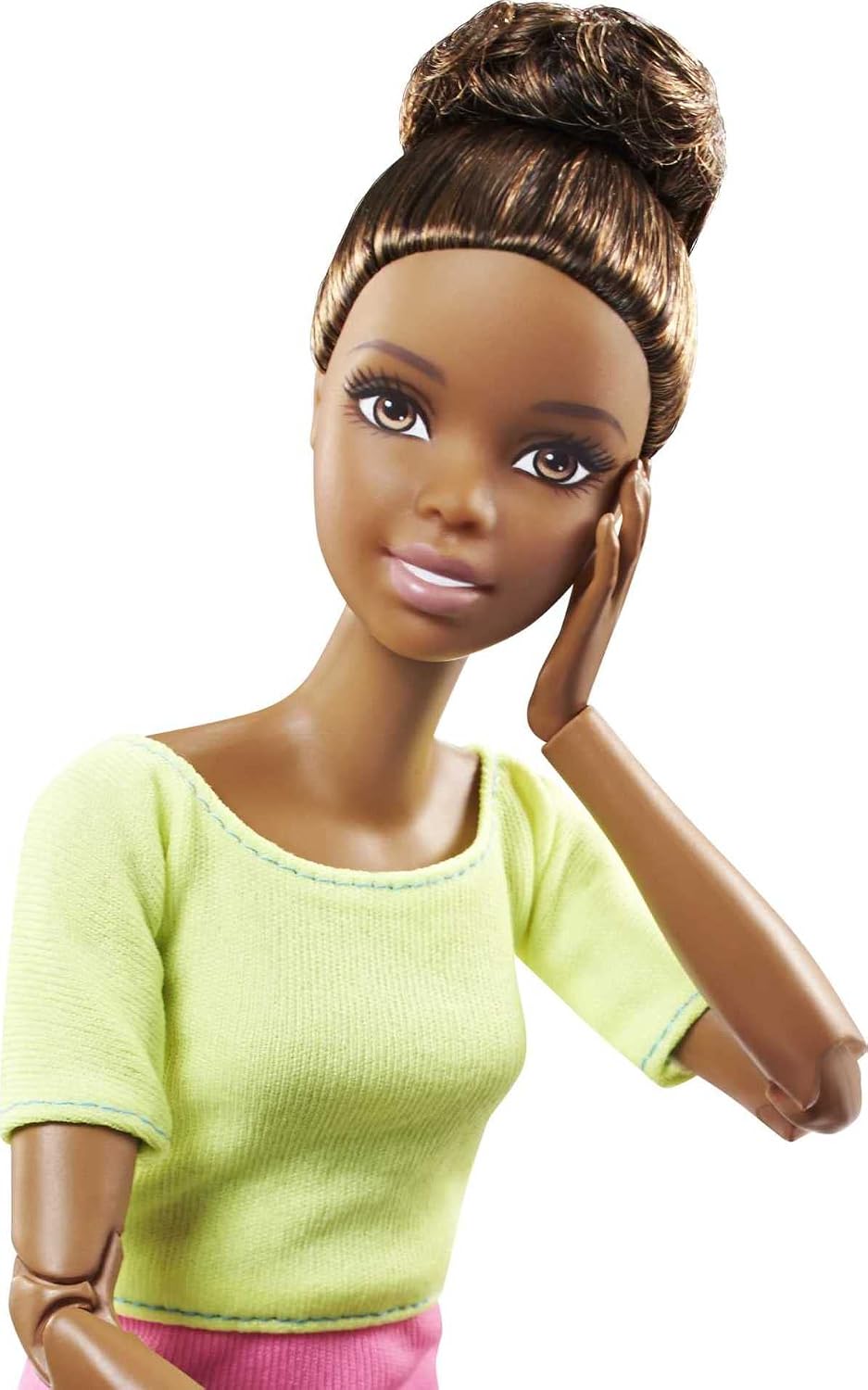 Barbie doll posed sitting cross-legged showcasing torso and hip joints.