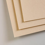 Crystal paper dividers protecting artwork pages in the pad