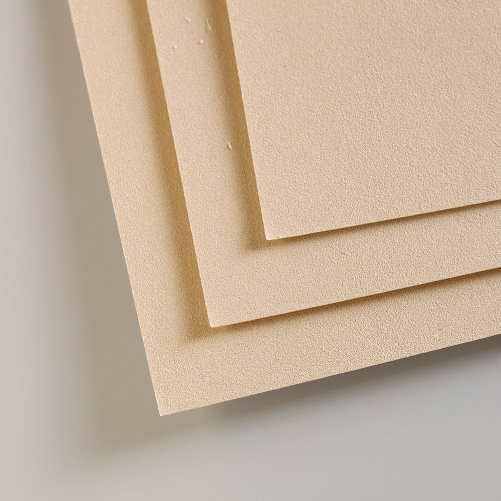 Crystal paper dividers protecting artwork pages in the pad