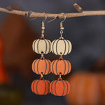 Pingyongchang spooky drop dangle earrings close up on wooden texture