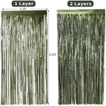 Dinosaur theme photo booth background using layered wavy green streamers.