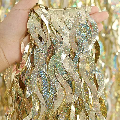 Three pack wavy shape shiny metallic tinsel curtains hanging on a party wall.