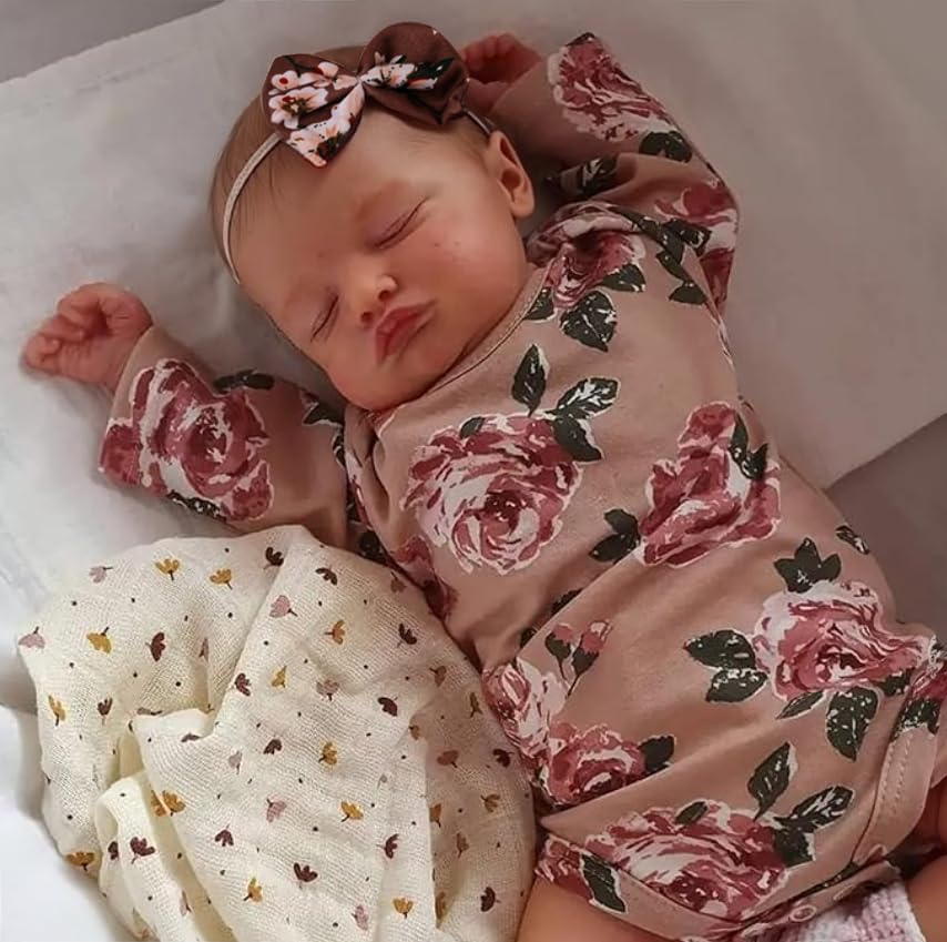 Kaydora reborn baby girl doll front view wearing a floral cabbage rose romper.