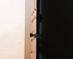 Losharher door latch cover mounted on a door knob
