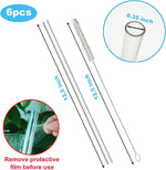 Clear reusable straws next to long cleaning brush