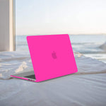 Anban hot pink case fitted securely on a compatible MacBook Pro