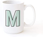 The Cotton And Canvas Co monogram coffee mug front view