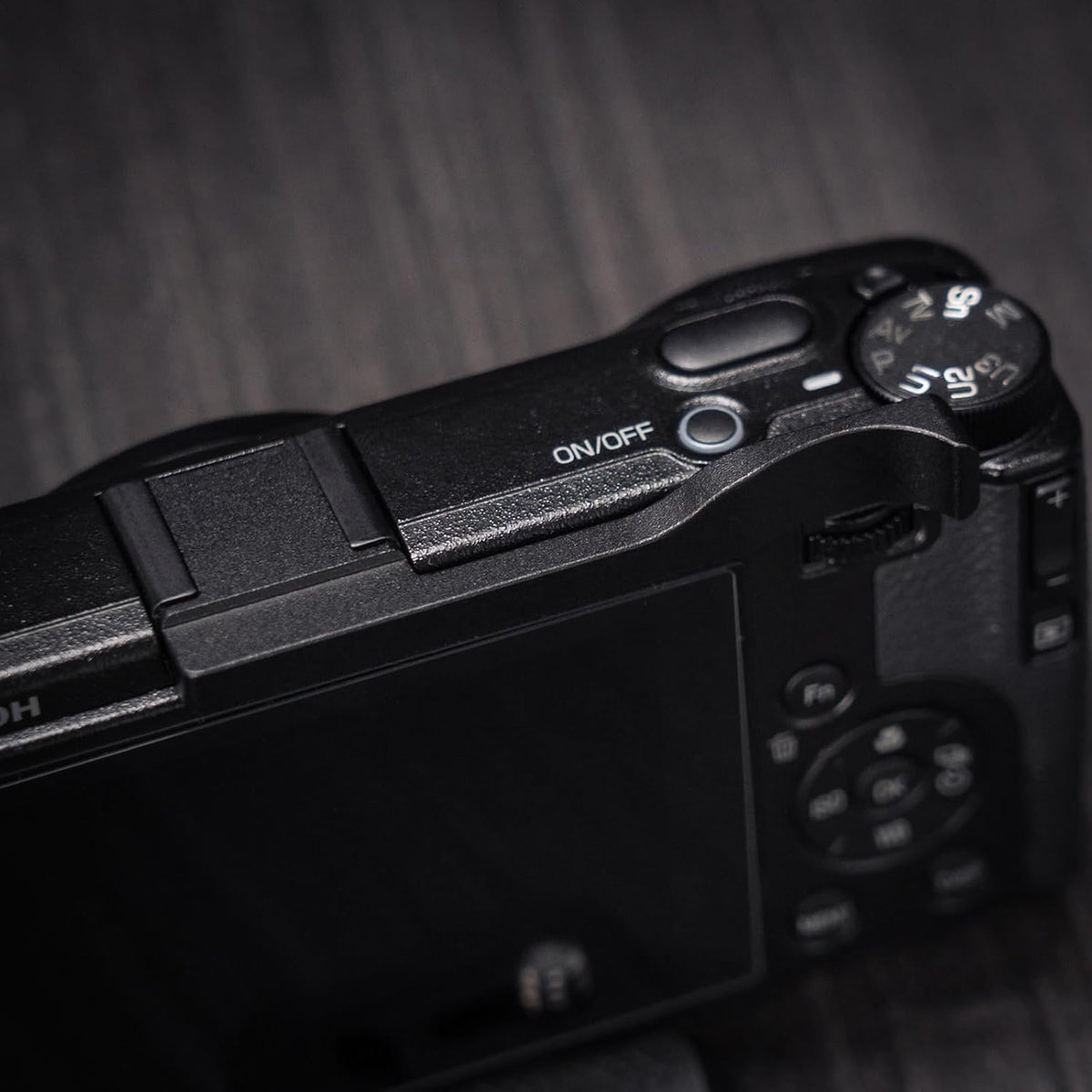 Iborrys thumb up grip for Ricoh GR IV camera front view showing premium black anodized finish.