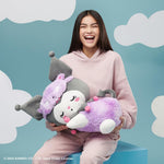 Kuromi sleeping plush displayed alongside bedroom decor