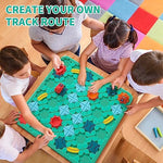 Overhead layout view of the complete Montessori learning puzzle toy kit including base boards, cars, marbles, and track segments.
