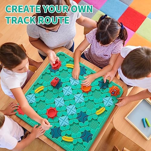Overhead layout view of the complete Montessori learning puzzle toy kit including base boards, cars, marbles, and track segments.